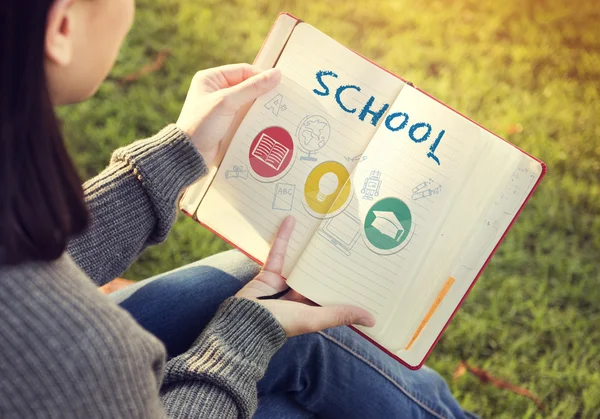 Woman with paper notebook in hands — Stock Photo, Image