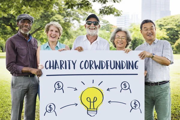 Senior Friends holding board — Stock Photo, Image