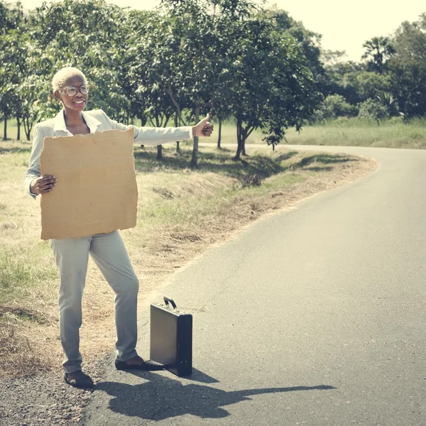 Businesswoman with empty Blank standing on road — Stock Photo, Image