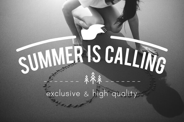 woman drawing heart symbol on beach