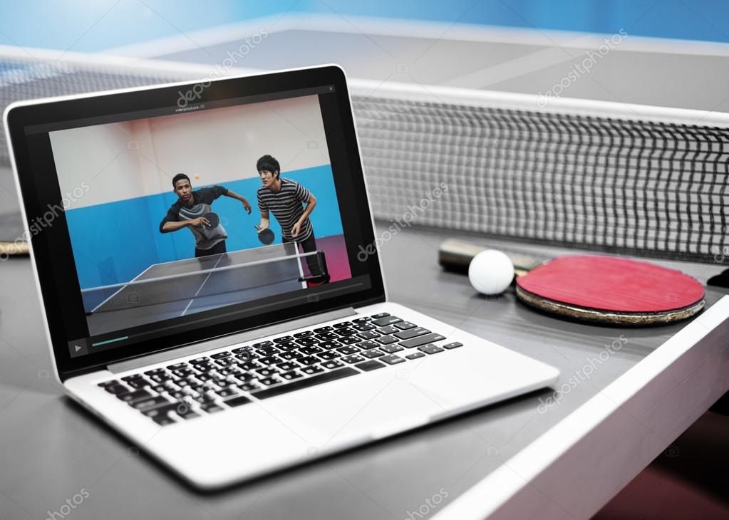opened laptop on ping pong table