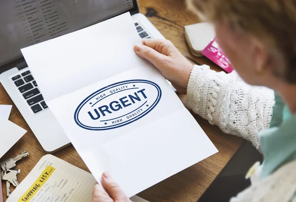 Piece of paper with Urgent — Stock Photo, Image