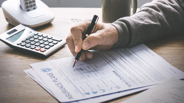 person writing on paper