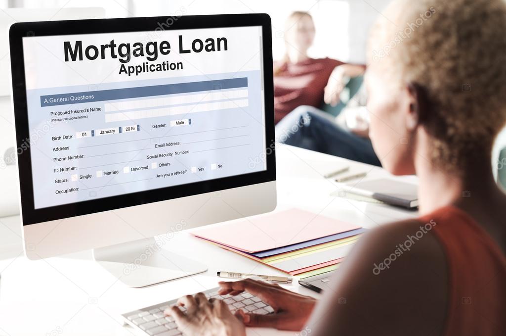 businesswoman working on computer with Mortgage Loan Application