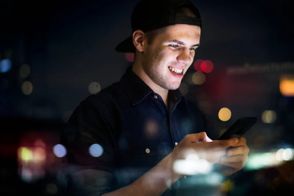 Happy Young Adult Male Using Smartphone Night Cityscape — Stock Photo, Image