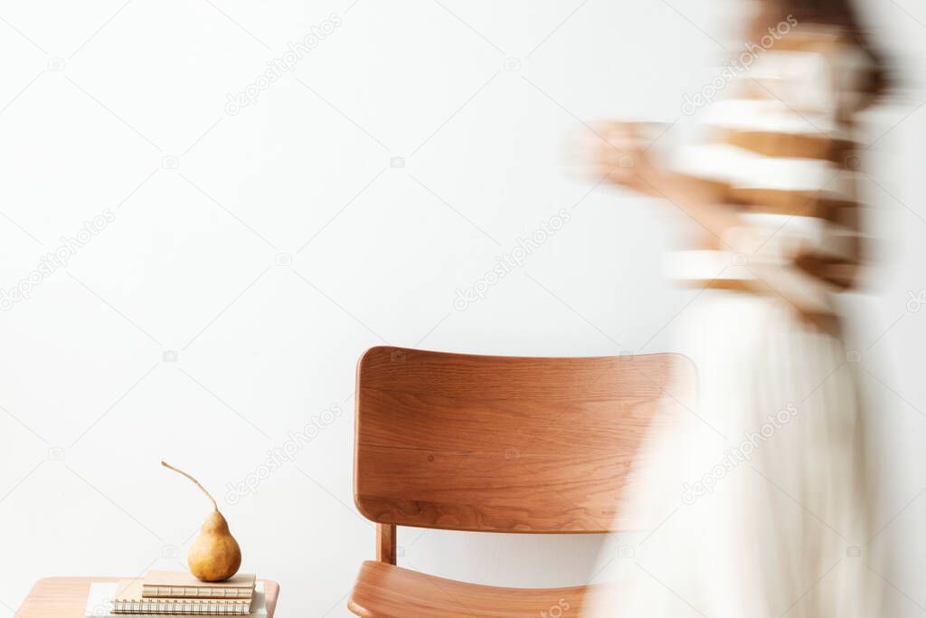 Blurred woman holding a coffee cup