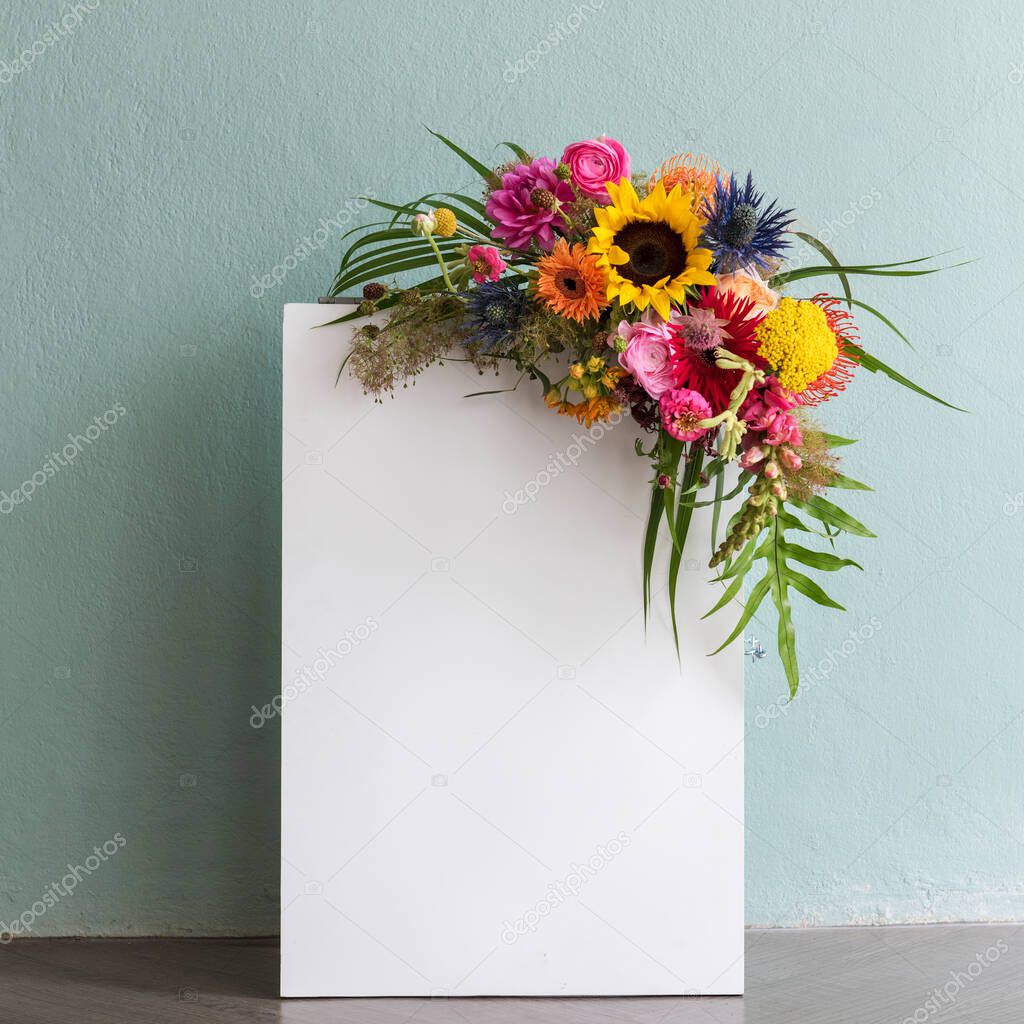Blank white paper with a bouquet with colorful flowers