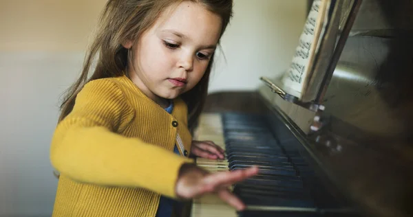 Cute Adorable Little Girl Learning How Play Piano — стоковое фото