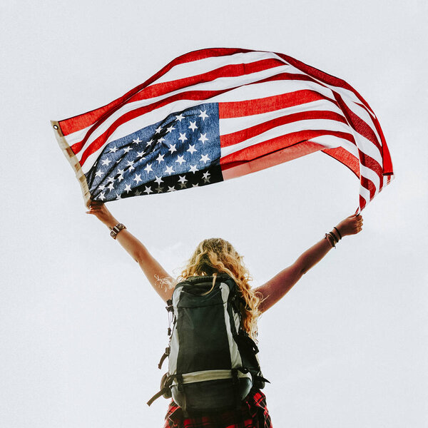 Caucasian Woman Holding American Flag Stock Image