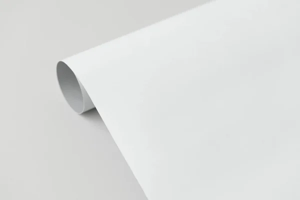 Grau Weiß Gerolltes Papier Auf Grauem Hintergrund — Stockfoto