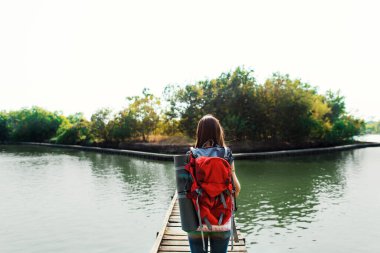 Woman traveller walking with backpack