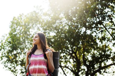 Woman traveller walking with backpack