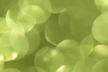 Parlak, bulanık yeşil parıltılı arkaplan