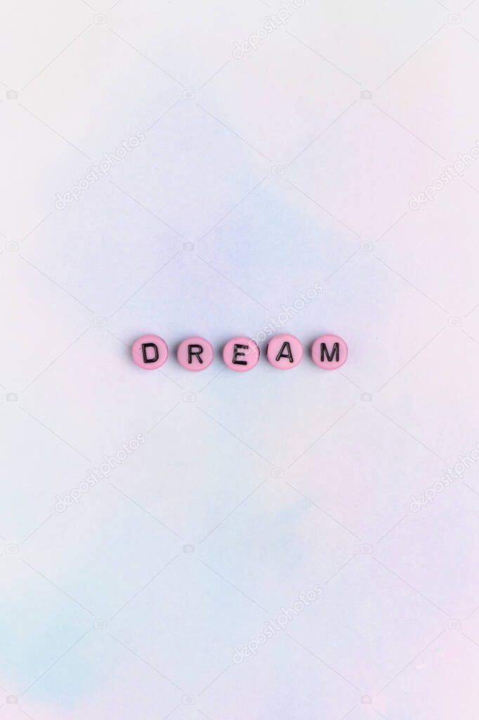 Pink DREAM beads text typography on pastel