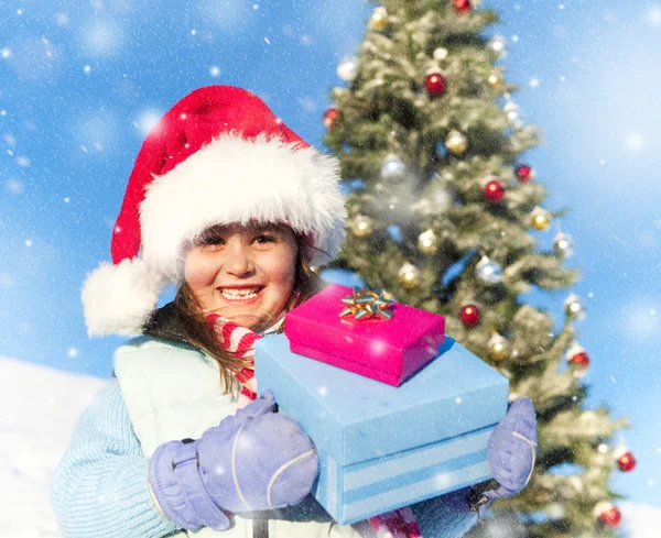 Menina com seus presentes — Fotografia de Stock