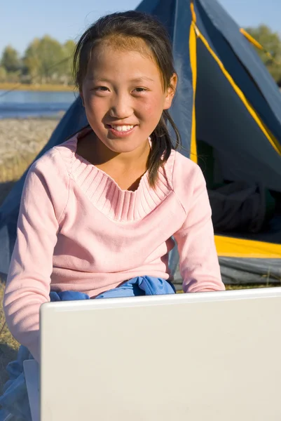 Mongolian girl with laptop — Stock Photo, Image