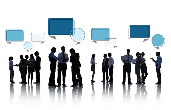 Silhouettes of Business People Discussing with Speech Bubbles — Stock Photo, Image