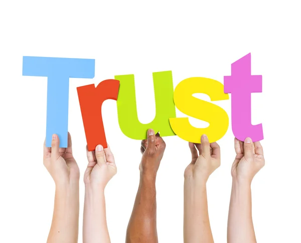 Braccia che detengono Word Trust — Foto Stock