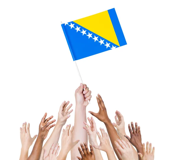 Arms Raised for Flag of Bosnia — Stock Photo, Image