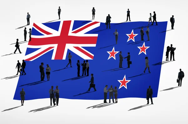 न्यूजीलैंड ध्वज पर व्यापारिक लोग — स्टॉक फ़ोटो, इमेज
