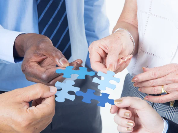 Hands with puzzle — Stock Photo, Image