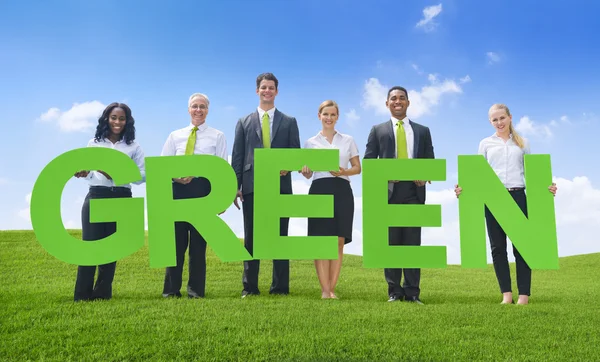 Business People holding word Green — Stock Photo, Image