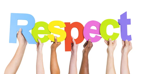 Personas que sostienen la palabra Respeto — Foto de Stock