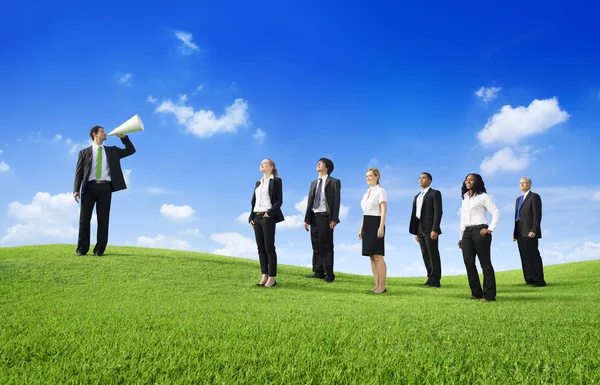 Green business people with leader — Stock Photo, Image