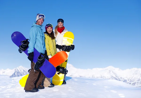 Três snowboarders — Fotografia de Stock