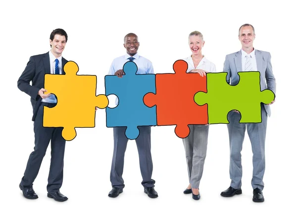 Business People Holding Puzzle Pieces — Stock Photo, Image