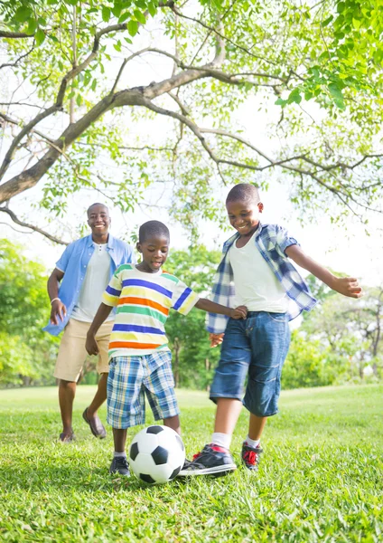 Boys playing football in Park — Stock Photo, Image