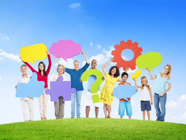 People Holding Symbols On Hill — Stock Photo, Image