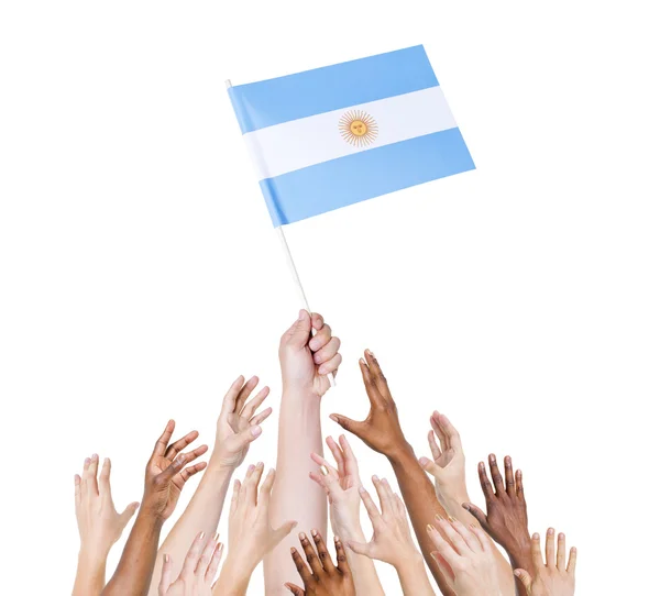 Ludzką ręką trzymając flagi agentina — Zdjęcie stockowe
