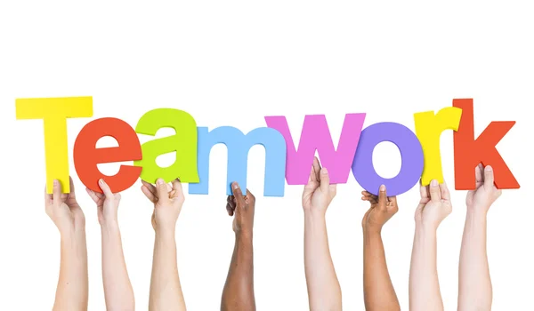 Arme halten Wort Teamwork — Stockfoto