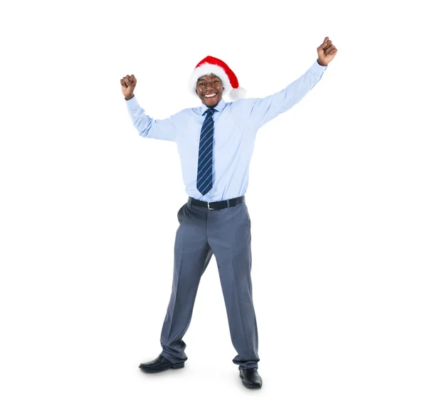 Affärsman i santa hatt firar — Stockfoto