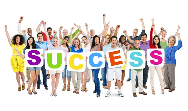 Personas que sostienen la palabra "Éxito" — Foto de Stock