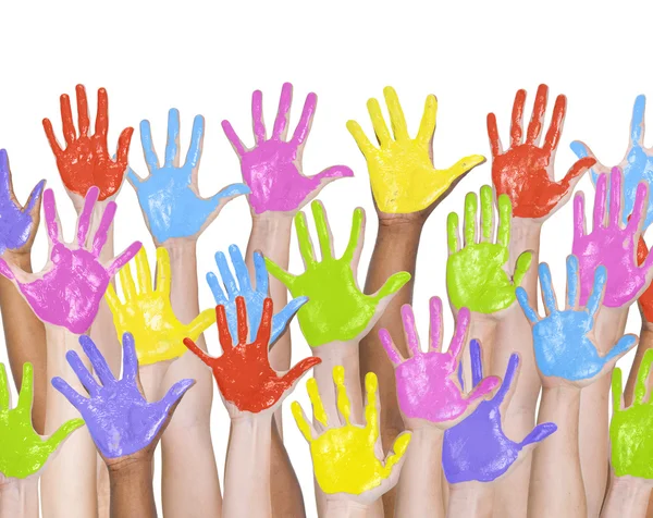 People's colorful pinted hands raised — Stock Photo, Image