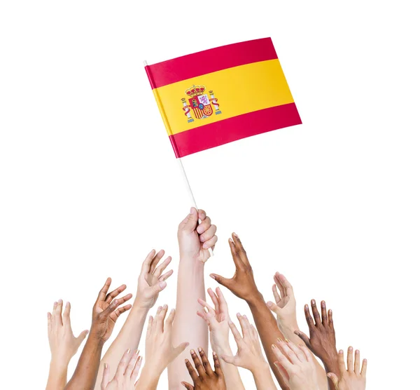 People reaching for flag of Spain — Stock Photo, Image