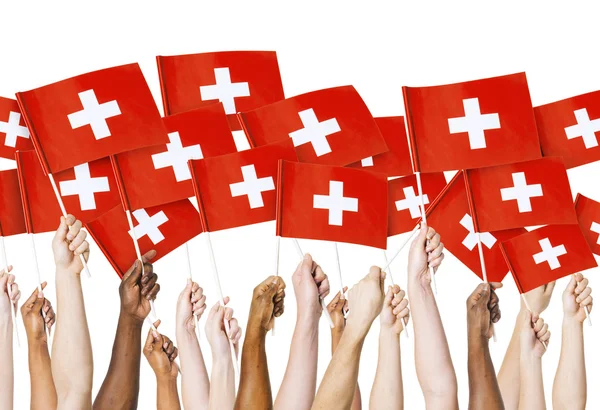 Arms holding Flags of Swizerland — Stock Photo, Image