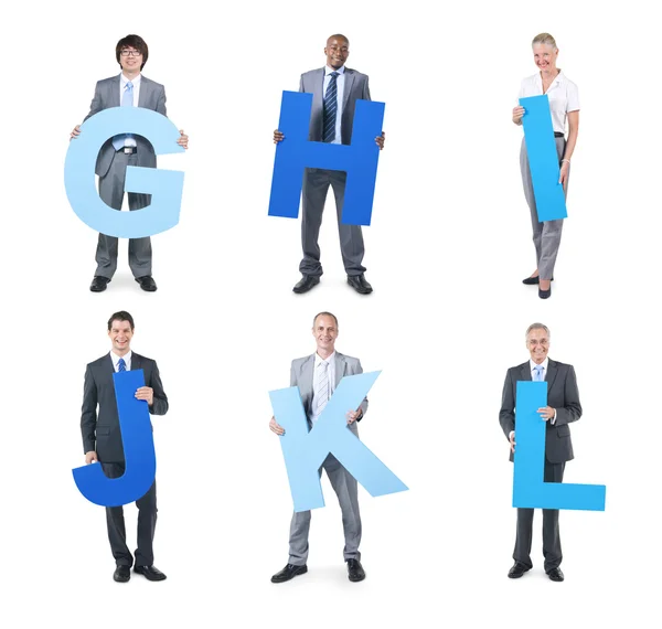 Business people holding the letters — Stock Photo, Image