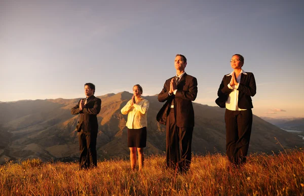 Business team meditating — Stock Photo, Image