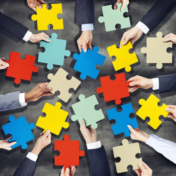 Hands Holding Colorful Jigsaw Pieces — Stock Photo, Image