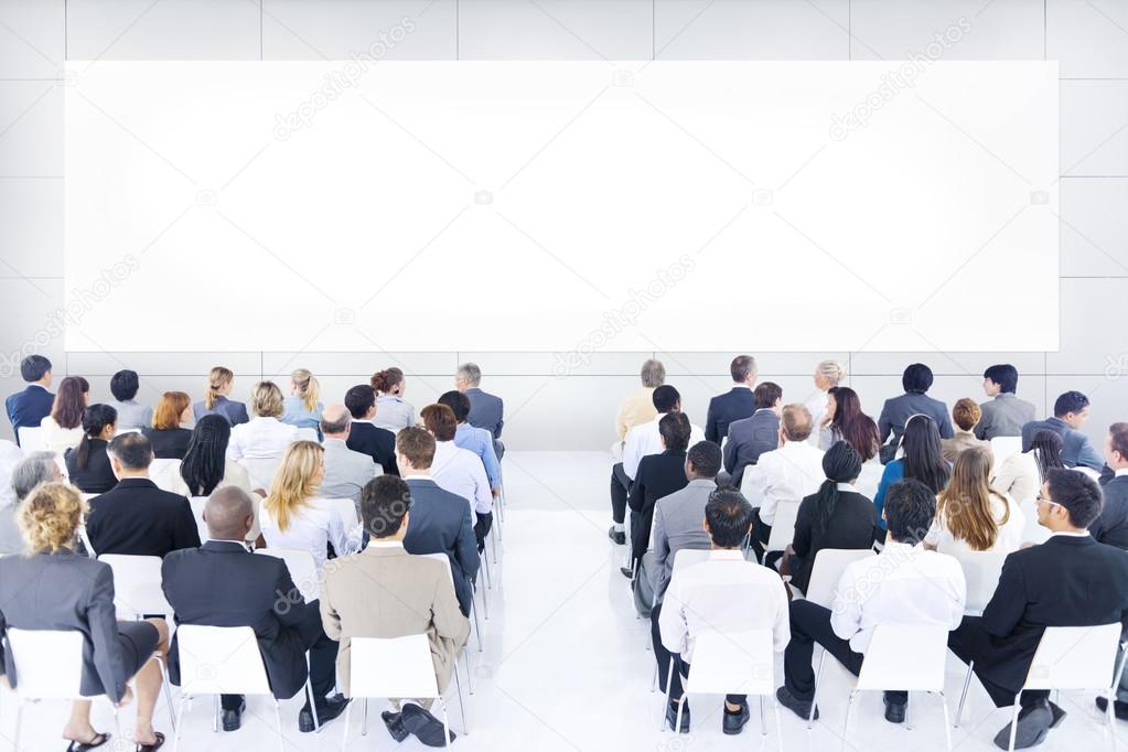 Large group of business people in presentation.