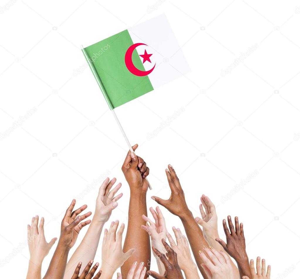 People holding Algerian flag