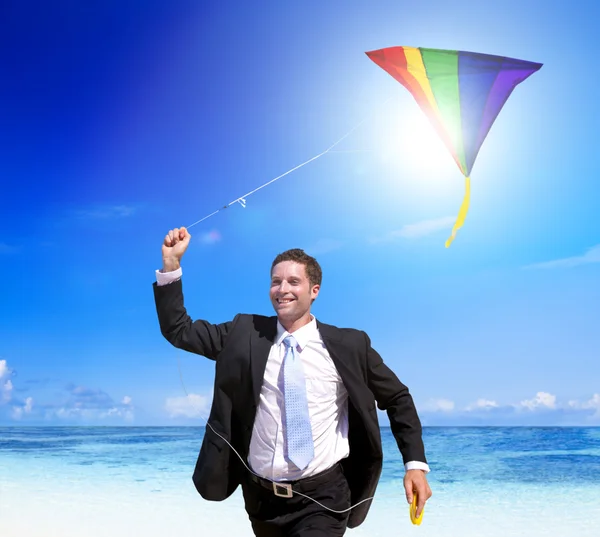Businessman relaxing on beach — Stock Photo, Image