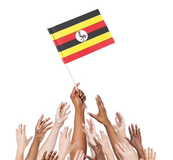 Χέρια υψωμένα για σημαία της Ουγκάντας — Φωτογραφία Αρχείου
