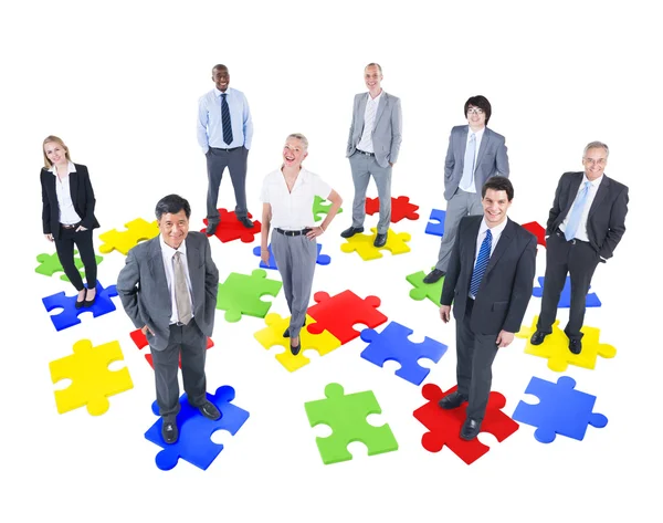 Business People on puzzle — Stock Photo, Image