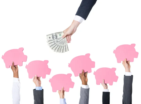 Hands holding Piggy Banks — Stock Photo, Image