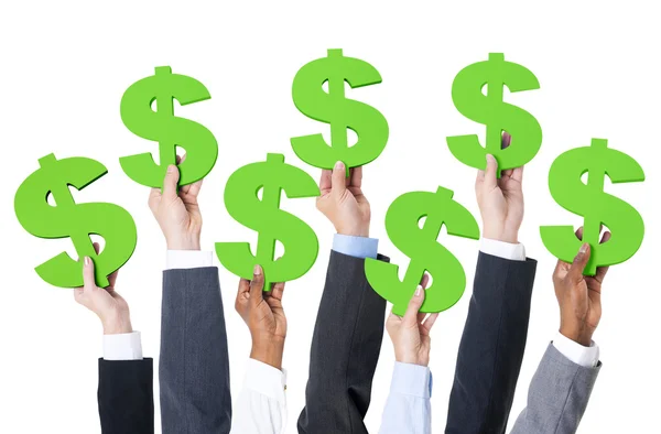 Business people holding dollar sign — Stock Photo, Image