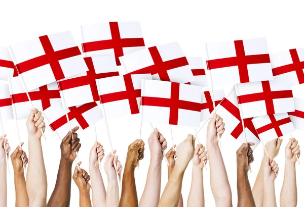Mãos segurando bandeiras inglesas — Fotografia de Stock